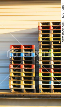 Pallets stacked in a distribution warehouse (beer pallets) Pallets stacked in a distribution warehouse (beer pallets) 67765889