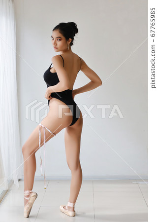 full length healthy and slim woman taking measurements of her body full length healthy and slim woman taking measurements of her body 67765985