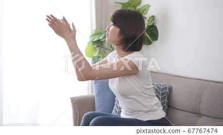 Young woman hitting mosquito Young woman hitting mosquito 67767474