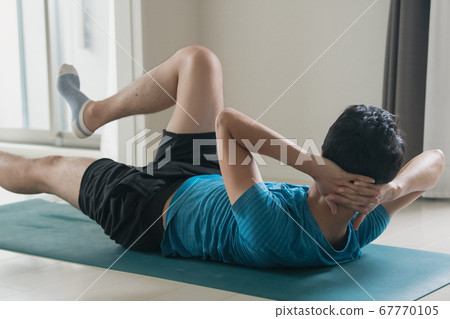 Image of a man doing muscle training, abdominal muscles and core training Image of a man doing muscle training, abdominal muscles and core training 67770105