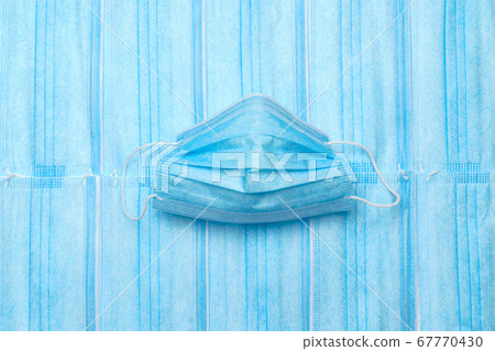 coronavirus COVID-19 pandemic concept - background made of antiviral surgical protective medical masks for protection against corona virus coronavirus COVID-19 pandemic concept - background made of antiviral surgical protective medical masks for protection against corona virus 67770430