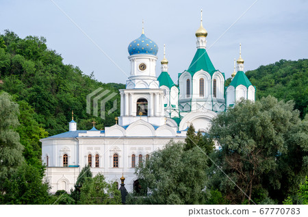 christian church in a green forest without people 67770783