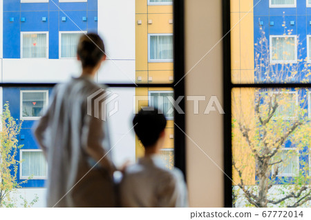 Man and woman couple in wheelchair looking out Man and woman couple in wheelchair looking out 67772014