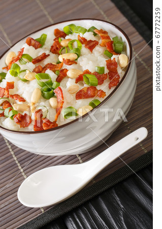 Rice porridge with bacon, peanuts and green onions Rice porridge with bacon, peanuts and green onions 67772259