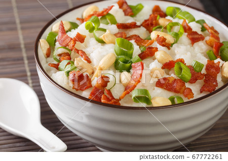 Ginger bacon Jook Rice Porridge close-up in a Ginger bacon Jook Rice Porridge close-up in a 67772261
