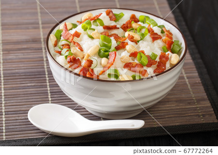Asian rice porridge with bacon, peanuts and green Asian rice porridge with bacon, peanuts and green 67772264