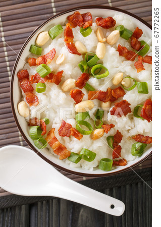 Rice porridge with bacon, peanuts and green onions 67772265