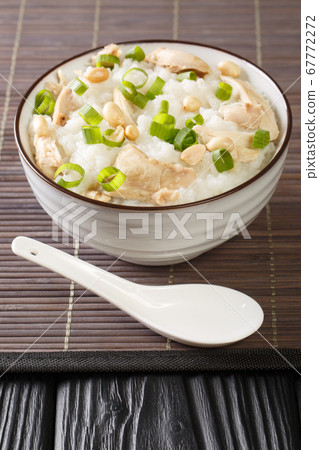 Ginger chicken Jook Rice Porridge close-up in a Ginger chicken Jook Rice Porridge close-up in a 67772272