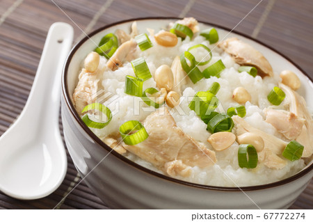 Chinese cooking, congee jook boiling rice with a Chinese cooking, congee jook boiling rice with a 67772274