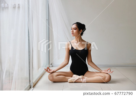 beautiful healthy asian woman in ballet dress enjoying in meditates with yoga pose at home 67772790