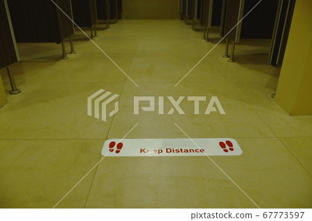 white sticker sign for social or physical distancing in coronavirus COVID-19 situation on public toilet floor white sticker sign for social or physical distancing in coronavirus COVID-19 situation on public toilet floor 67773597