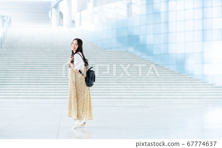 College student walking on campus College student walking on campus 67774637
