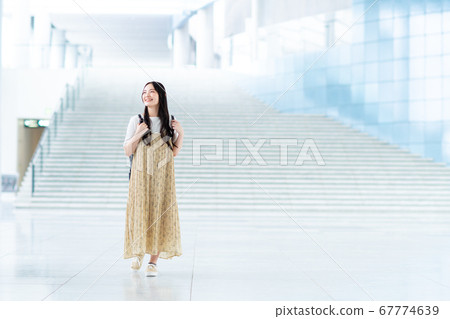 College student walking on campus College student walking on campus 67774639