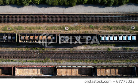 Aerial view of rail sorting freight station with railway cars, with many rail tracks railroad. Heavy industry landscape. Aerial view of rail sorting freight station with railway cars, with many rail tracks railroad. Heavy industry landscape. 67775322