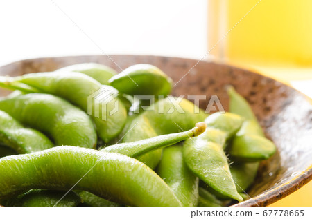 A classic summer dish, a combination of edamame and beer 67778665