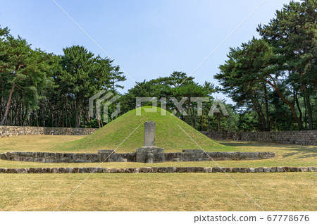 GIMHAE, SOUTH KOREA - JUNE 18, 2017 : Ancient traditional Korean Pasa stone pagoda or wind-calming pagoda at the Royal tomb of king Suro of Gaya kingdom in Gimehae, South Gyeongsang province, South Ko GIMHAE, SOUTH KOREA - JUNE 18, 2017 : Ancient traditional Korean Pasa stone pagoda or wind-calming pagoda at the Royal tomb of king Suro of Gaya kingdom in Gimehae, South Gyeongsang province, South Ko 67778676