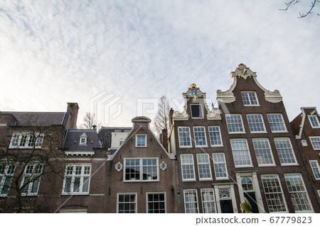 Amsterdam cityscape, Holland Lawn square and elongated brick houses Amsterdam cityscape, Holland Lawn square and elongated brick houses 67779823
