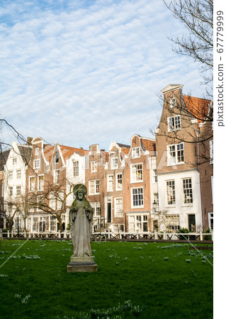 Amsterdam cityscape, Holland Lawn square and elongated brick houses Amsterdam cityscape, Holland Lawn square and elongated brick houses 67779999