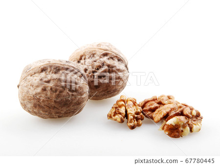 Close-Up Of Walnuts Isolated On White 67780445