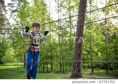 Cute child boy playing. Artworks depict games at 67781762