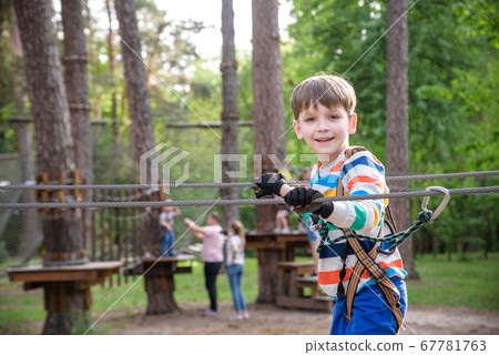 Cute child boy playing. Artworks depict games at 67781763