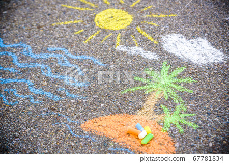 Closeup top view of child's chalk drawing of 67781834