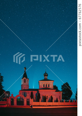 Korma Village, Dobrush District, Belarus. Comet Neowise C2020f3 In Night Starry Sky Above St. John The Korma Convent Church In Korma Village. Famous Orthodox Church And Historic Heritage Korma Village, Dobrush District, Belarus. Comet Neowise C2020f3 In Night Starry Sky Above St. John The Korma Convent Church In Korma Village. Famous Orthodox Church And Historic Heritage 67782576