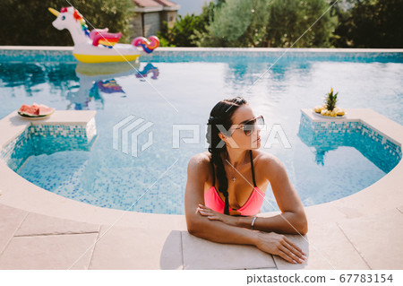 hot sexy woman relax in swimming pool  67783154