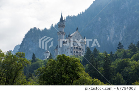 Neuschwanstein castle in bavaria, germany cloudy mood mountain Neuschwanstein castle in bavaria, germany cloudy mood mountain 67784008