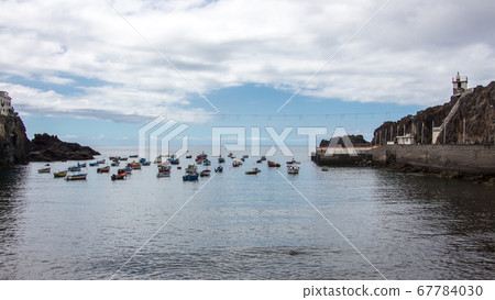 Fisher boats on the sea horizon camara de lobos madeira 67784030