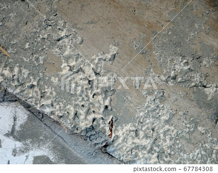New fresh concrete surface with honeycomb problem and exposing reinforcement bar inside. The problem weakens concrete strength. New fresh concrete surface with honeycomb problem and exposing reinforcement bar inside. The problem weakens concrete strength. 67784308