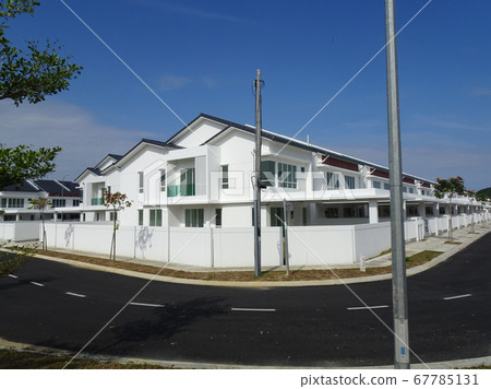 SEREMBAN, MALAYSIA -APRIL 08, 2020: New double story luxury terrace house in Malaysia. Designed by an architect with a modern and contemporary style. Ready to receive occupants. SEREMBAN, MALAYSIA -APRIL 08, 2020: New double story luxury terrace house in Malaysia. Designed by an architect with a modern and contemporary style. Ready to receive occupants. 67785131