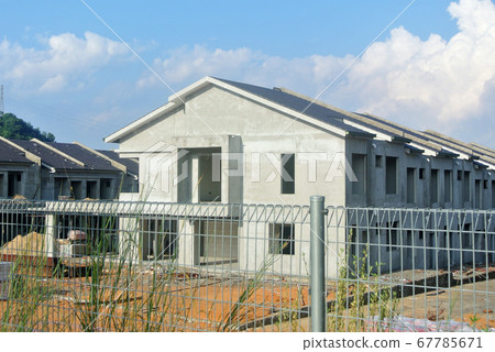 SEREMBAN, MALAYSIA -APRIL 07, 2020: New double story luxury terrace house under construction in Malaysia.  Designed by an architect with a modern and contemporary style.  67785671