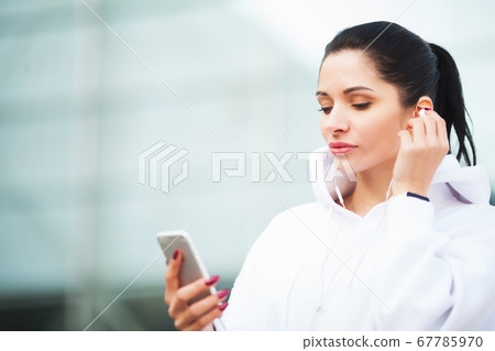 Fitness woman doing workout standing in a stadium background. Fitness woman doing workout standing in a stadium background. 67785970