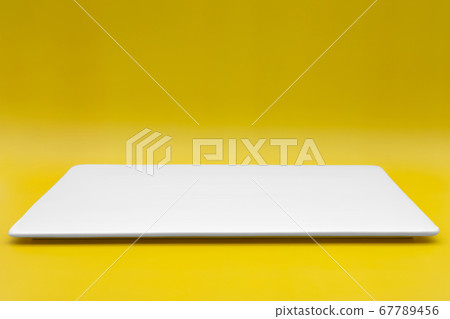 A rectangle empty white plate isolated on the yellow background. 67789456