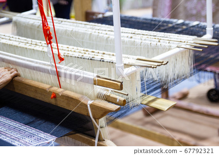 Weaving equipment Household weaving - Detail of weaving loom for homemade silk Used for silk weaving or textile production of Thailand 67792321