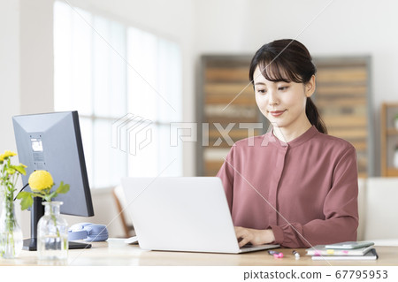 Young woman working at home 67795953