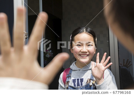 Elementary school girl going to school to pick up at a friend's house Elementary school girl going to school to pick up at a friend's house 67796168