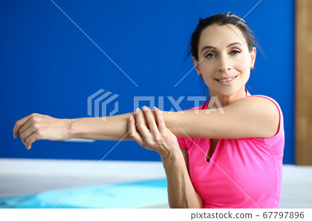 Beautiful woman hold her hand and pull to side. 67797896