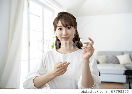 Young woman portrait looking at camera 67798295
