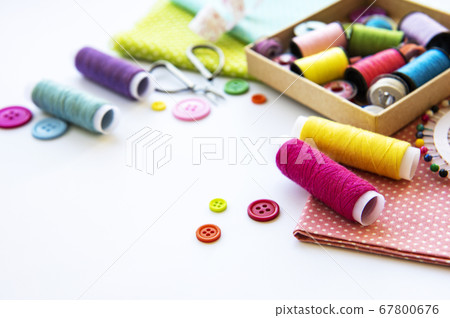 Sewing accessories on a white background 67800676