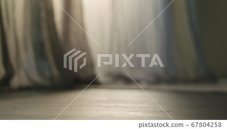 low angle shot of interior with day light and curtains moved by a wind low angle shot of interior with day light and curtains moved by a wind 67804258