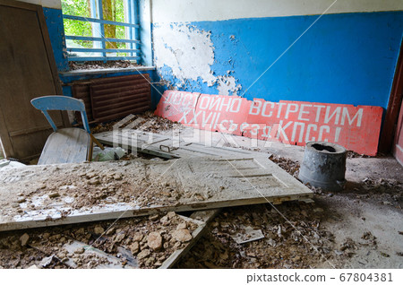 Poster with socialist slogan in abandoned building in Chernobyl exclusion zone, Belarus Poster with socialist slogan in abandoned building in Chernobyl exclusion zone, Belarus 67804381
