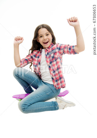 Time to ride. Kid girl excited sits penny board. 67806653