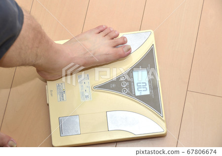 Senior man on scales and feet Senior man on scales and feet 67806674