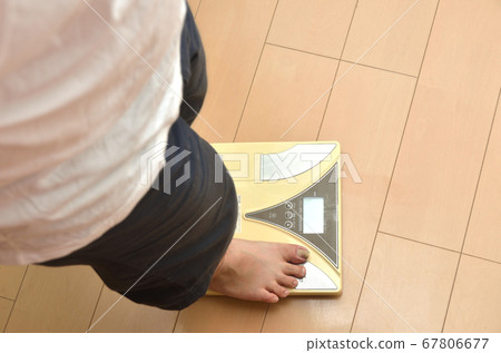Senior man on scales and feet 67806677
