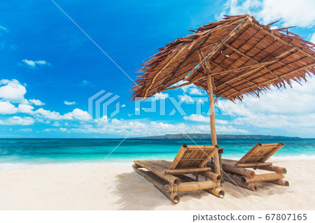 Beach chairs and umbrella 67807165