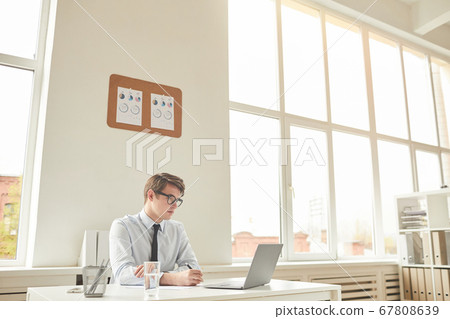 Wide Angle View at Businessman in Office Wide Angle View at Businessman in Office 67808639