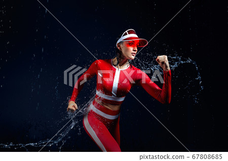 Beautiful young girl in sportswear runing in aqua Beautiful young girl in sportswear runing in aqua 67808685