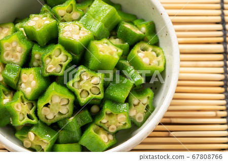 Okra (round sliced). Summer image in the background blinds. Okra (round sliced). Summer image in the background blinds. 67808766
